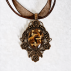 Pendentif orgonite ovale baroque oeil de tigre couleur bronze