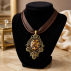 Pendentif orgonite ovale baroque oeil de tigre couleur bronze